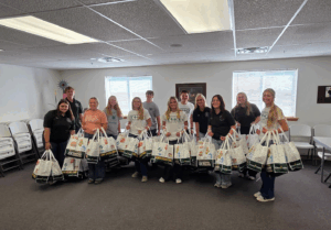 Image of Washington County 4-H students and advisors holding white safety bags.